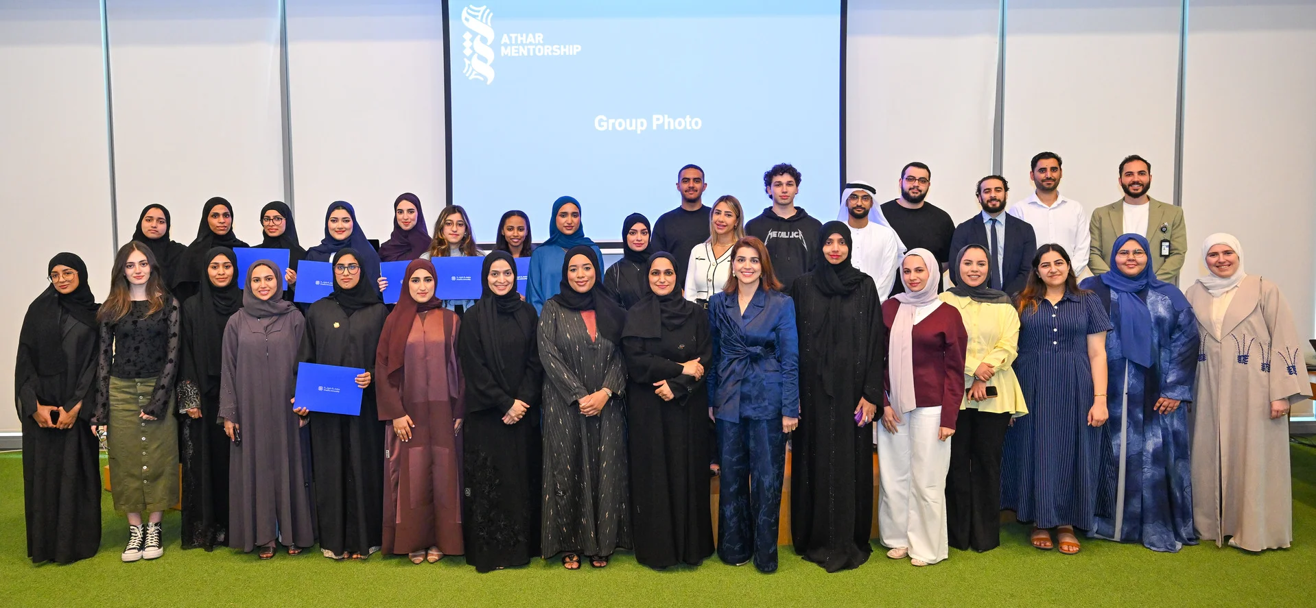 Athar alumni mentoring program Cohort 1 closing ceremony group photo at Khalifa University with mentors and student mentees