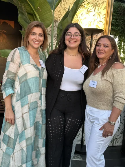 Three Impactiv team members together at a mentorship event