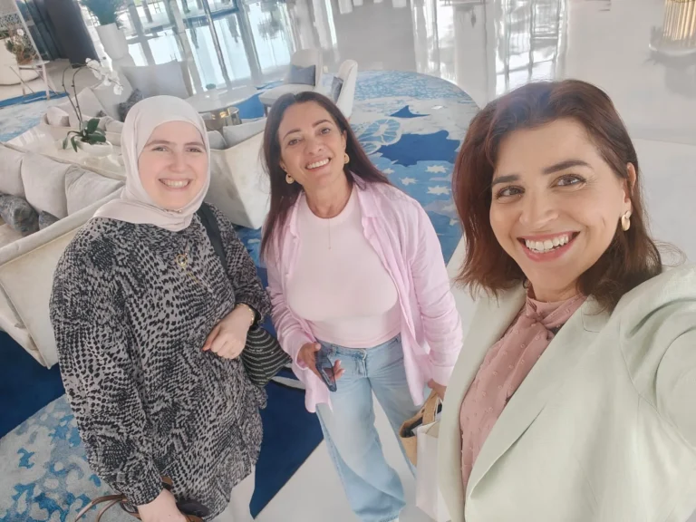 Three members of the Intersection program team smiling together